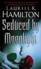 Cover image for Seduced By Moonlight by Laurell K. Hamilton.